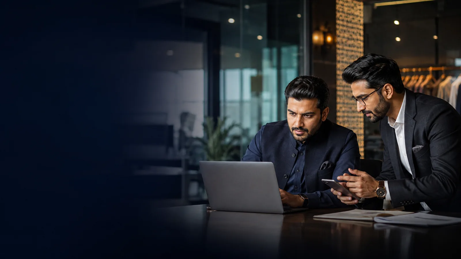 Pakistani business owner and consultant reviewing digital solutions